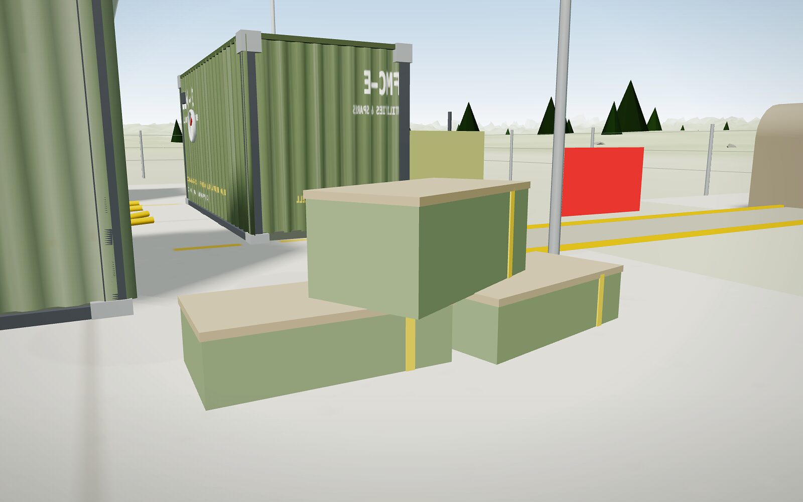 Crate-out at the D end in the 3D model: sealed crates staged beside FMC-E, the red banner behind.